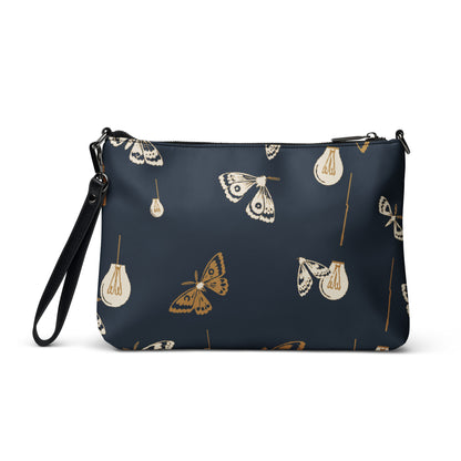 Moth Party Crossbody Bag with deep navy ivory and ochre moth and lightbulb pattern, back view