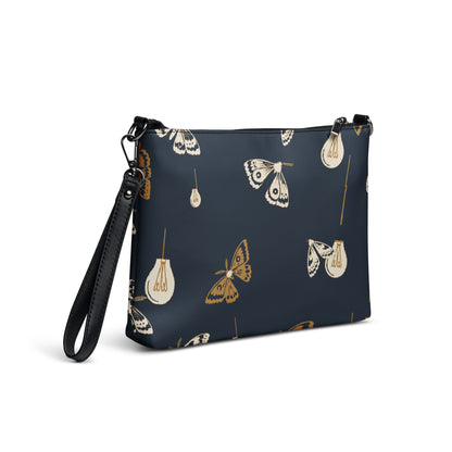 Moth Party Crossbody Bag with deep navy ivory and ochre moth and lightbulb pattern, right back view