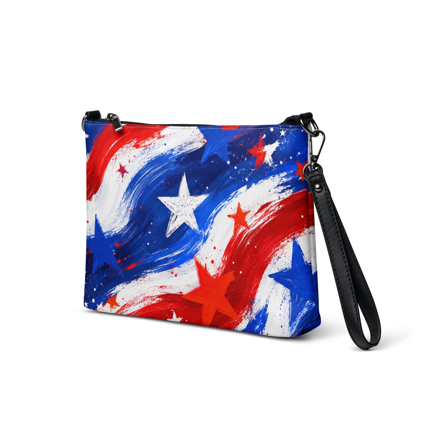 Stars and Stripes all-over print crossbody bag in painted red, white, and blue brushstrokes with scattered stars, black hardware and removable strap