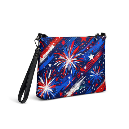 Star-Spangled Sky all-over print crossbody bag with red, white, and blue fireworks bursts and stars on deep navy, black hardware and removable strap