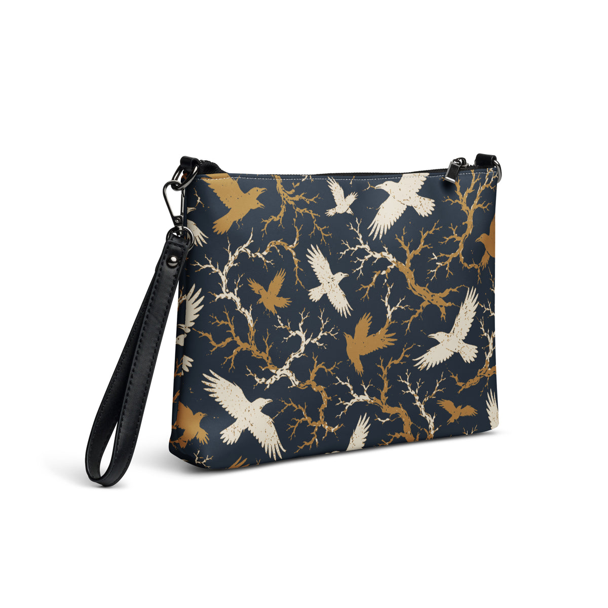 Faux leather crossbody bag with all-over cream and gold raven and bare branch print on navy background, dark gray hardware, front view