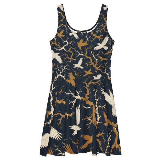 Sleeveless all-over print skater dress with cream and gold raven and bare branch print on navy background, flared skirt, front view