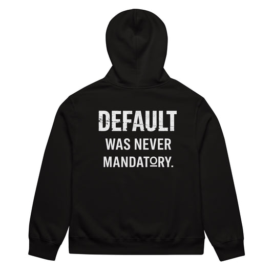 The Default Was Never Mandatory oversized graphic hoodie in black, back view showing bold white statement typography across upper back, dropped shoulder oversized silhouette.