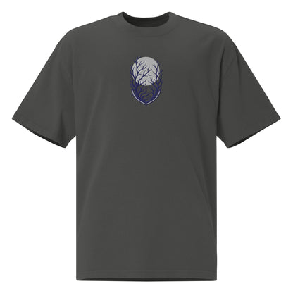 Own the Dark oversized faded t-shirt in faded coal showing the navy embroidered moon and branches shield emblem up close
