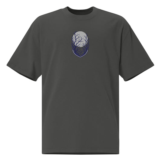 Own the Dark oversized faded t-shirt in faded coal showing the navy embroidered moon and branches shield emblem up close