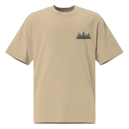 Faded khaki oversized t-shirt with a small embroidered pine tree cluster design on the left chest
