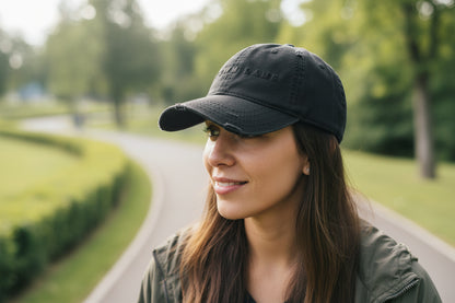 My Own Lane distressed dad hat in black, front view showing black on black geometric MY OWN LANE embroidery across front panel, distressed brim and crown, low profile unstructured fit.
