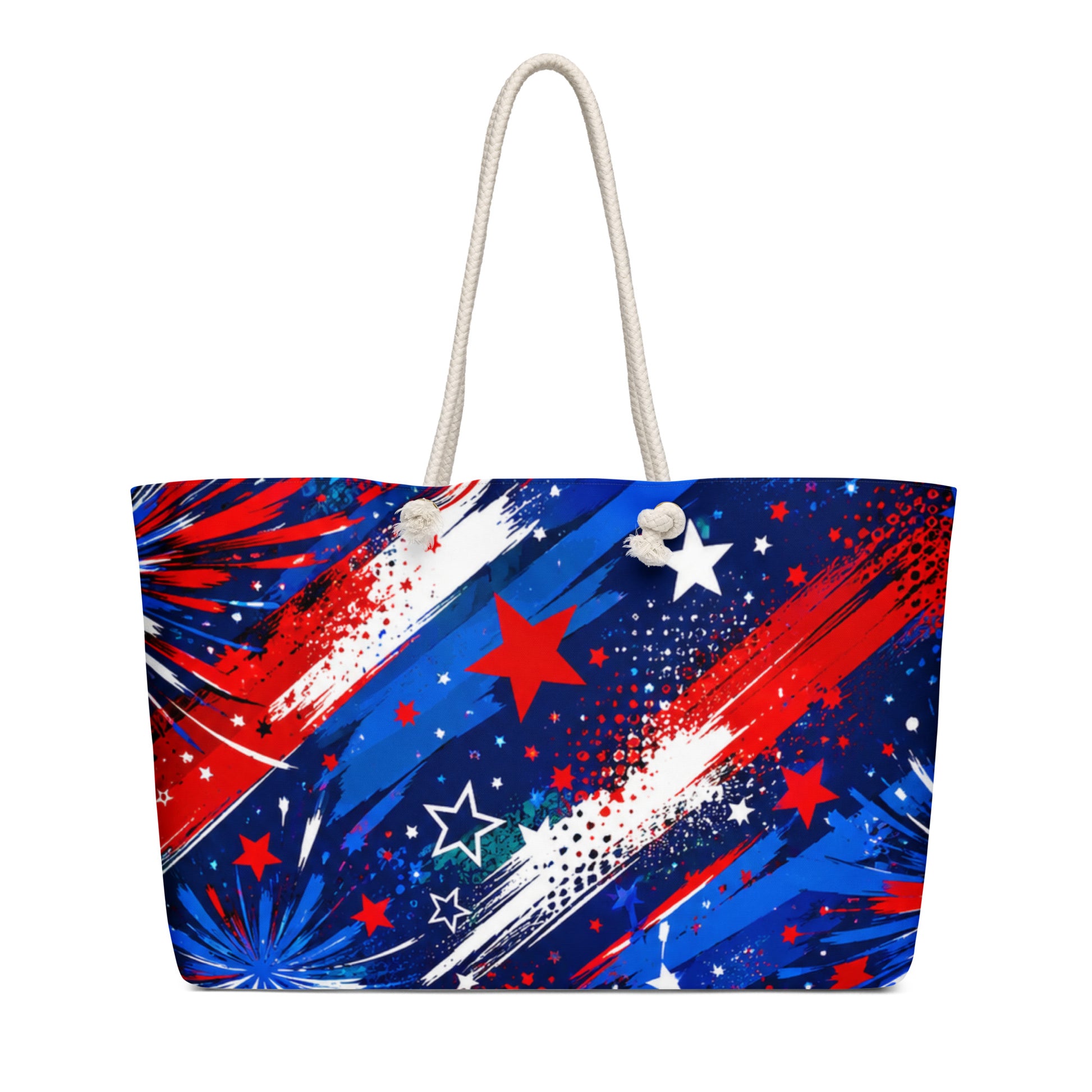 Star-Spangled Sky all-over print oversized weekender tote with red, white, and blue fireworks bursts and stars on deep navy and cream rope handles