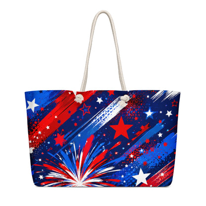 Star-Spangled Sky all-over print oversized weekender tote with red, white, and blue fireworks bursts and stars on deep navy and cream rope handles