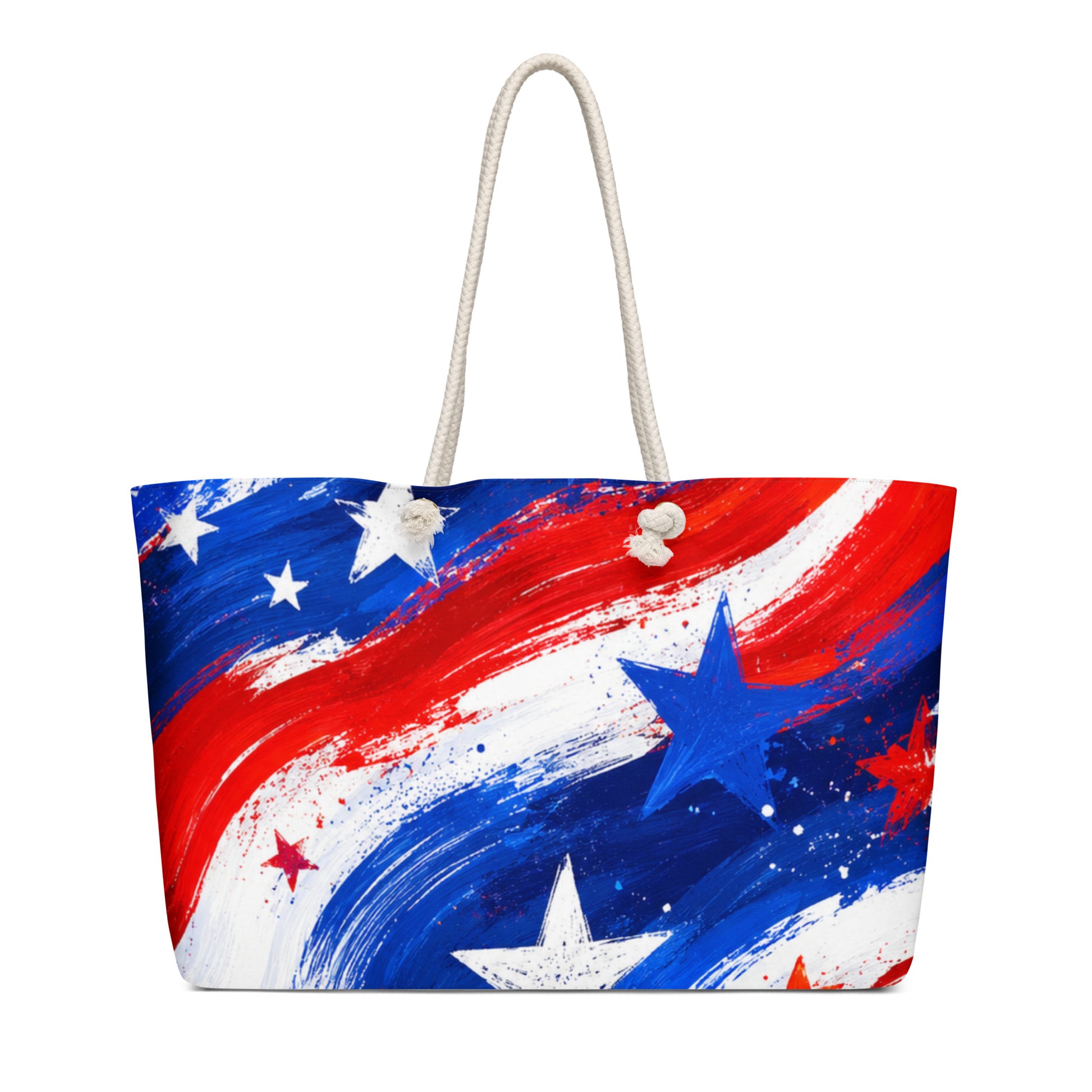 Stars and Stripes all-over print oversized weekender tote in painted red, white, and blue brushstrokes with scattered stars and cream rope handles