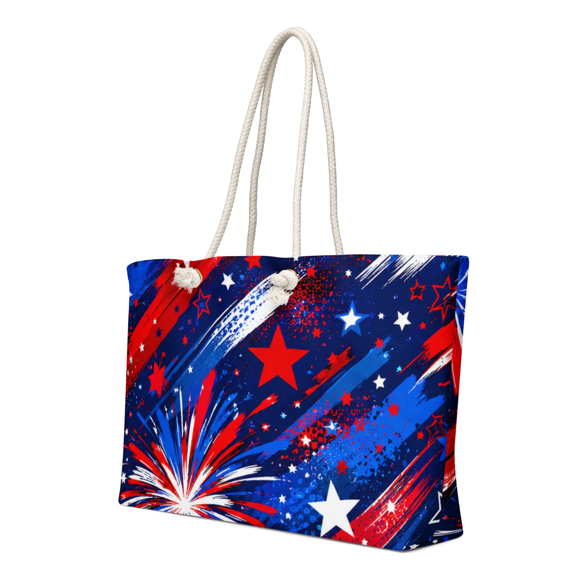 Star-Spangled Sky all-over print oversized weekender tote with red, white, and blue fireworks bursts and stars on deep navy and cream rope handles