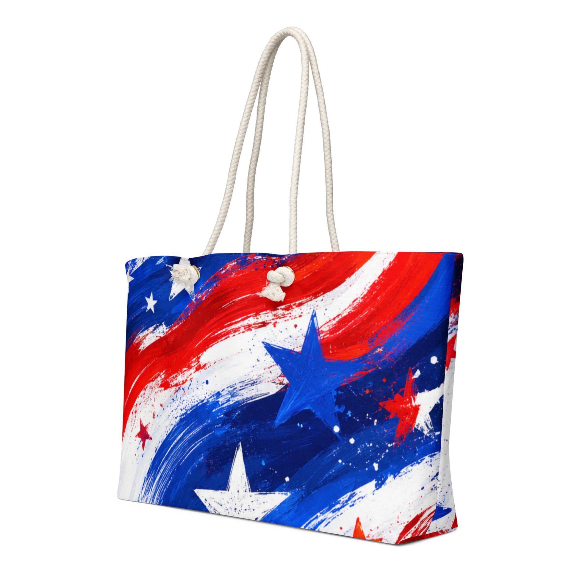 Stars and Stripes all-over print oversized weekender tote in painted red, white, and blue brushstrokes with scattered stars and cream rope handles