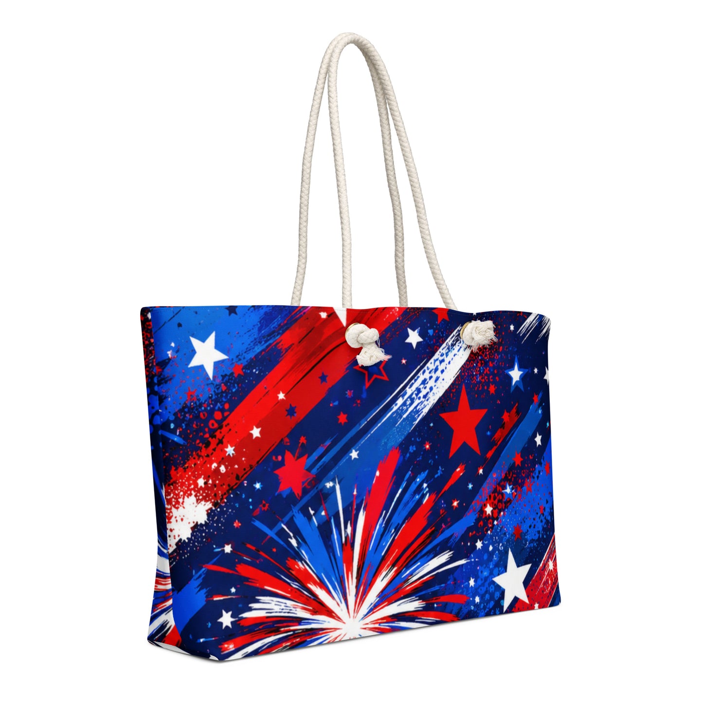 Star-Spangled Sky all-over print oversized weekender tote with red, white, and blue fireworks bursts and stars on deep navy and cream rope handles