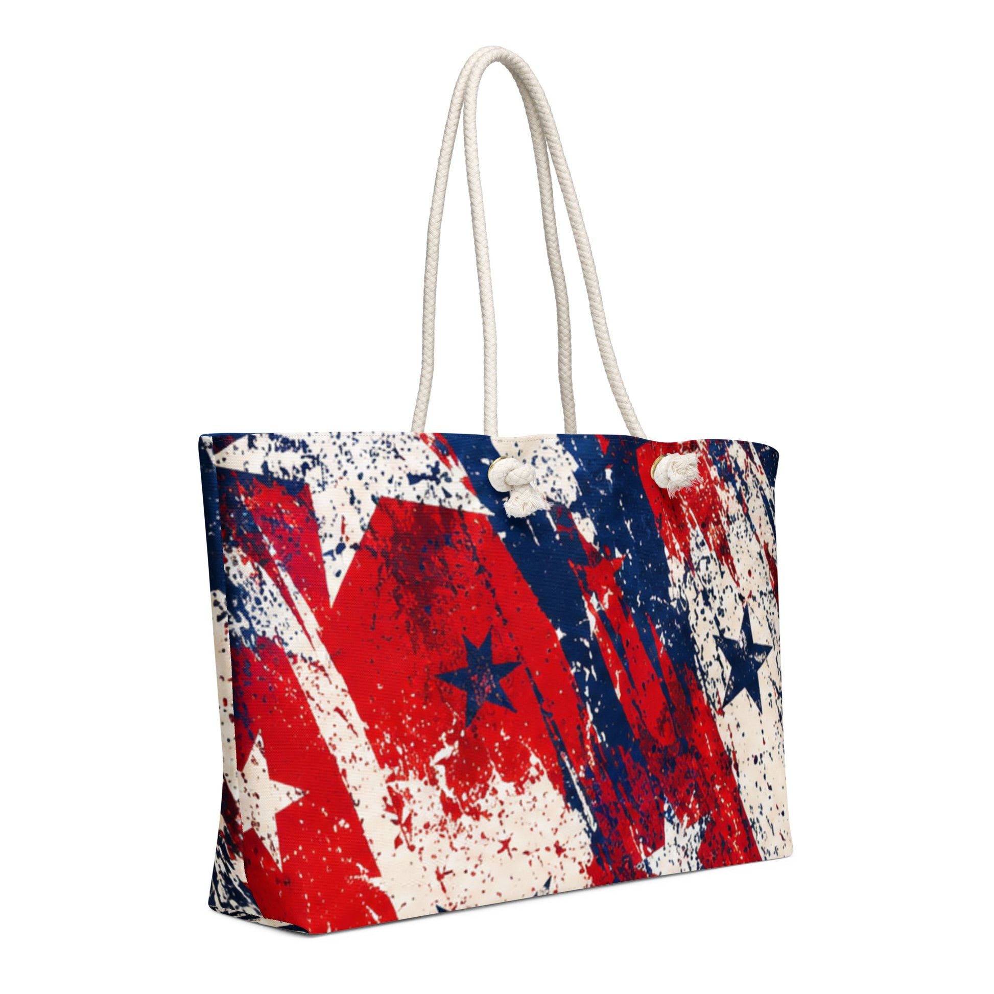 Grunge Stars and Stripes all-over print oversized weekender tote in distressed red, white, and blue with scattered stars and cream rope handles from No 925