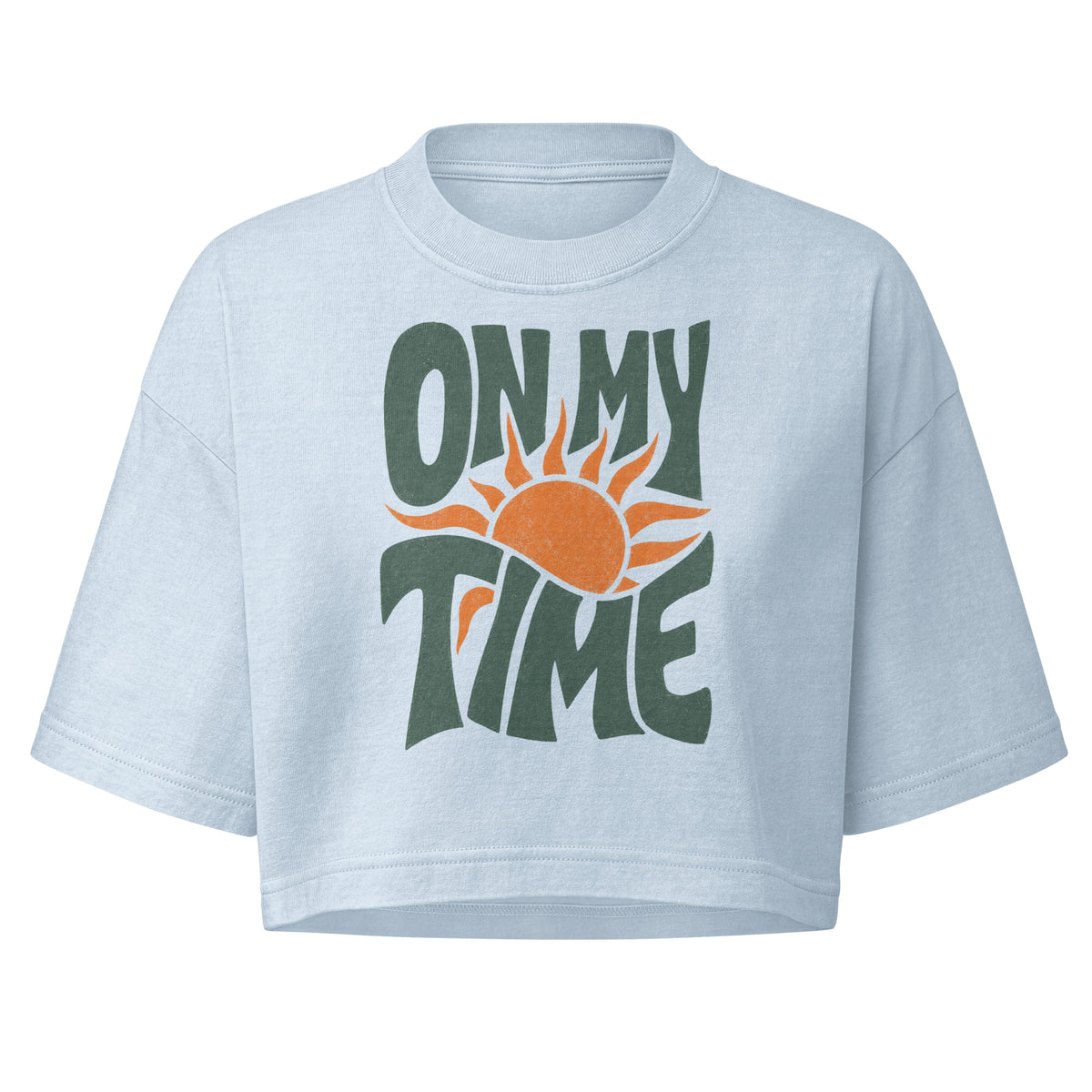 On My Time garment dye cropped tee with ON MY TIME in dark green retro lettering wrapped around an orange rising sun