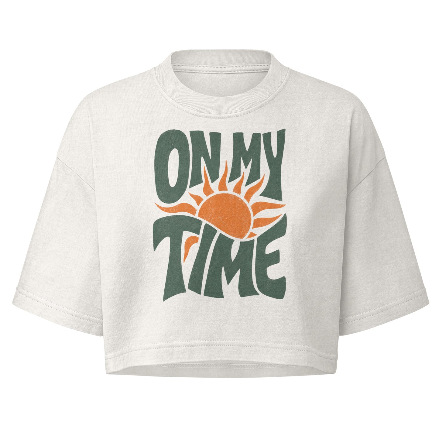 On My Time garment dye cropped tee with ON MY TIME in dark green retro lettering wrapped around an orange rising sun