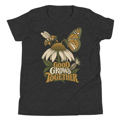 Good Grows Together Youth T-Shirt, front view with a bee and orange butterfly visiting a flower above GOOD GROWS TOGETHER lettering
