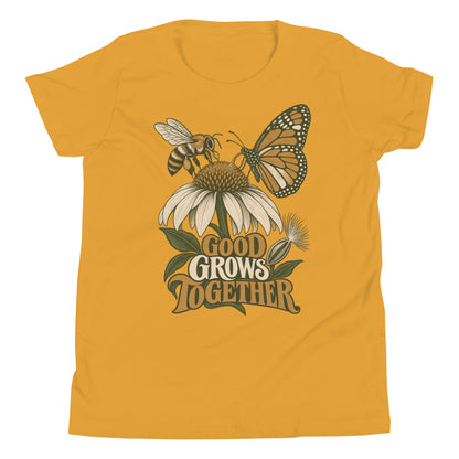 Good Grows Together Youth T-Shirt, front view with a bee and orange butterfly visiting a flower above GOOD GROWS TOGETHER lettering